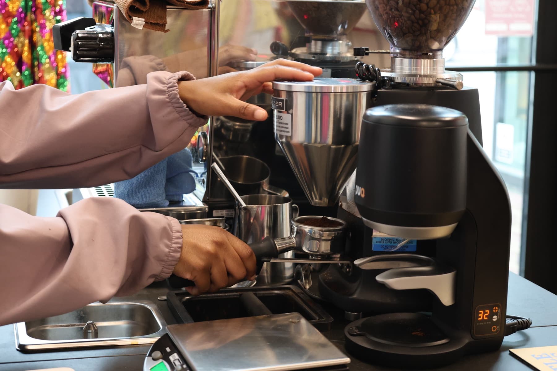 Espréssate barista tamping a shot of espresso on the mobile bar at a Triangle event